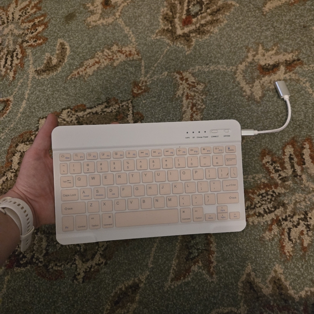 Bluetooth Keuboard For Cell Phones Or Tablets Comes With USB Cord Pink And White